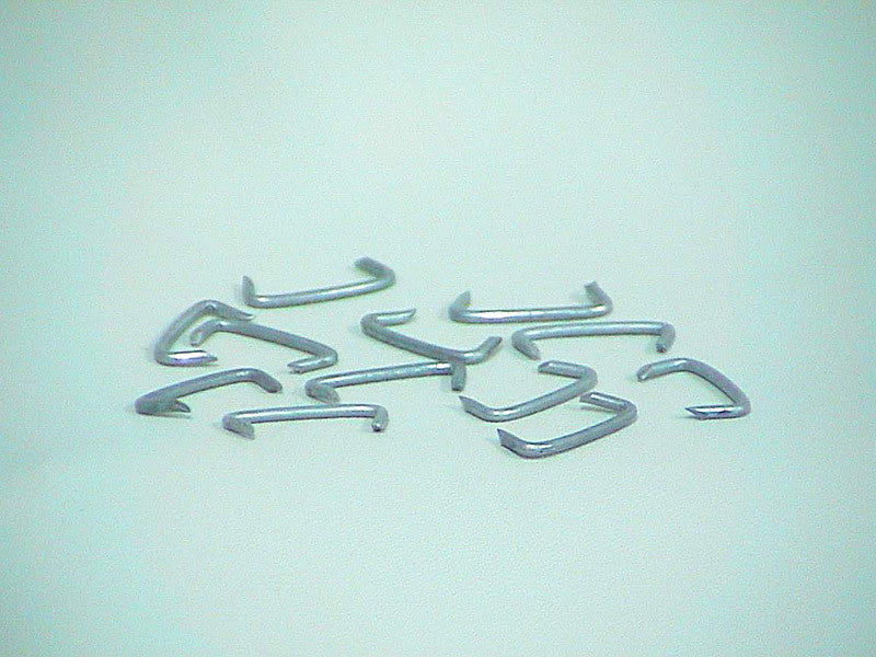 Durable metal upholstery hooks designed for securely mounting and attaching fabric or leather upholstery to furniture frames. One bag contains 100 hooks.